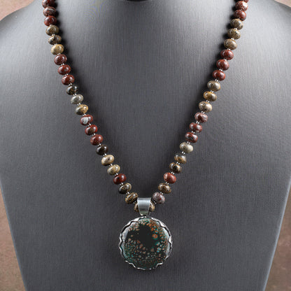 Enamel and jasper necklace with teal, black, and coppery kiln-fired enamel pendant in sterling silver bezel on a 20 inch jasper strand.