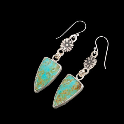 Kingman turquoise sterling silver drop earrings with shield-shaped blue-green stones, fine silver settings, flower accents, and sterling silver ear wires, handmade in Vermont by Divella Designs.