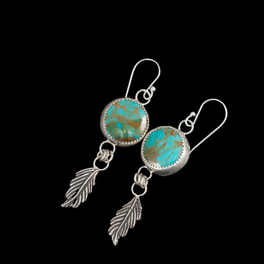 Kingman turquoise sterling silver drop earrings with fine silver settings, feather accents, and sterling silver ear wires, handmade in Vermont by Divella Designs.