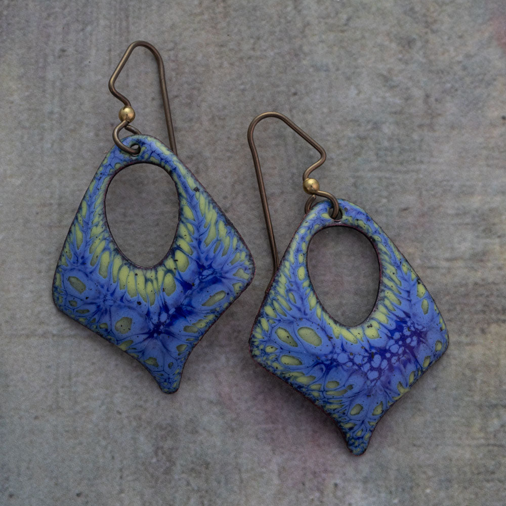 Lichen Glow enameled earrings in vibrant blue and yellow-green tones with organic teardrop cutouts, and hypoallergenic niobium ear wires handmade artisan jewelry.