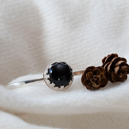 Sterling silver cuff bracelet with 14mm black onyx cabochon in gallery bezel, handcrafted in Vermont, 6-inch length with 1-inch gap.