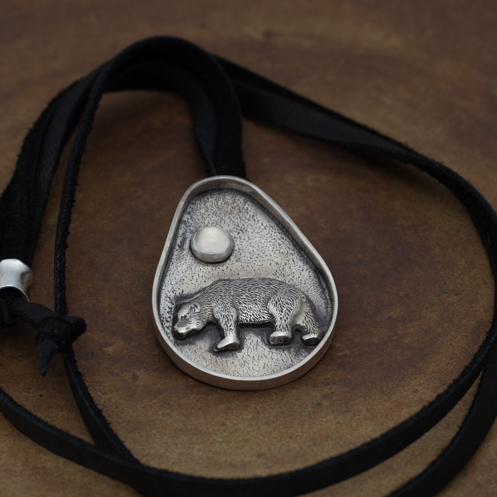 Sterling silver bear necklace shown on 38 inch black leather lace