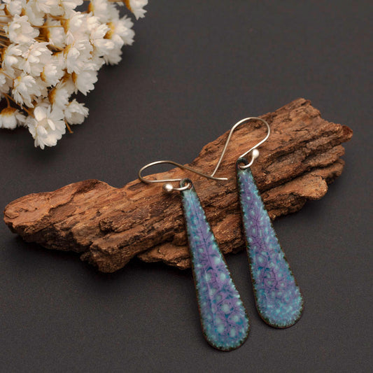 Celestial-inspired handmade enamel teardrop earrings in shades of purple and blue with sterling silver ear wires.