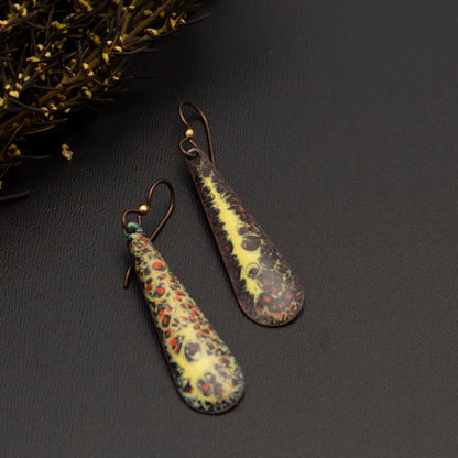 Brown, orange, and yellow enamel teardrop earrings with autumn-inspired texture and niobium ear wires, handmade by Divella Designs.