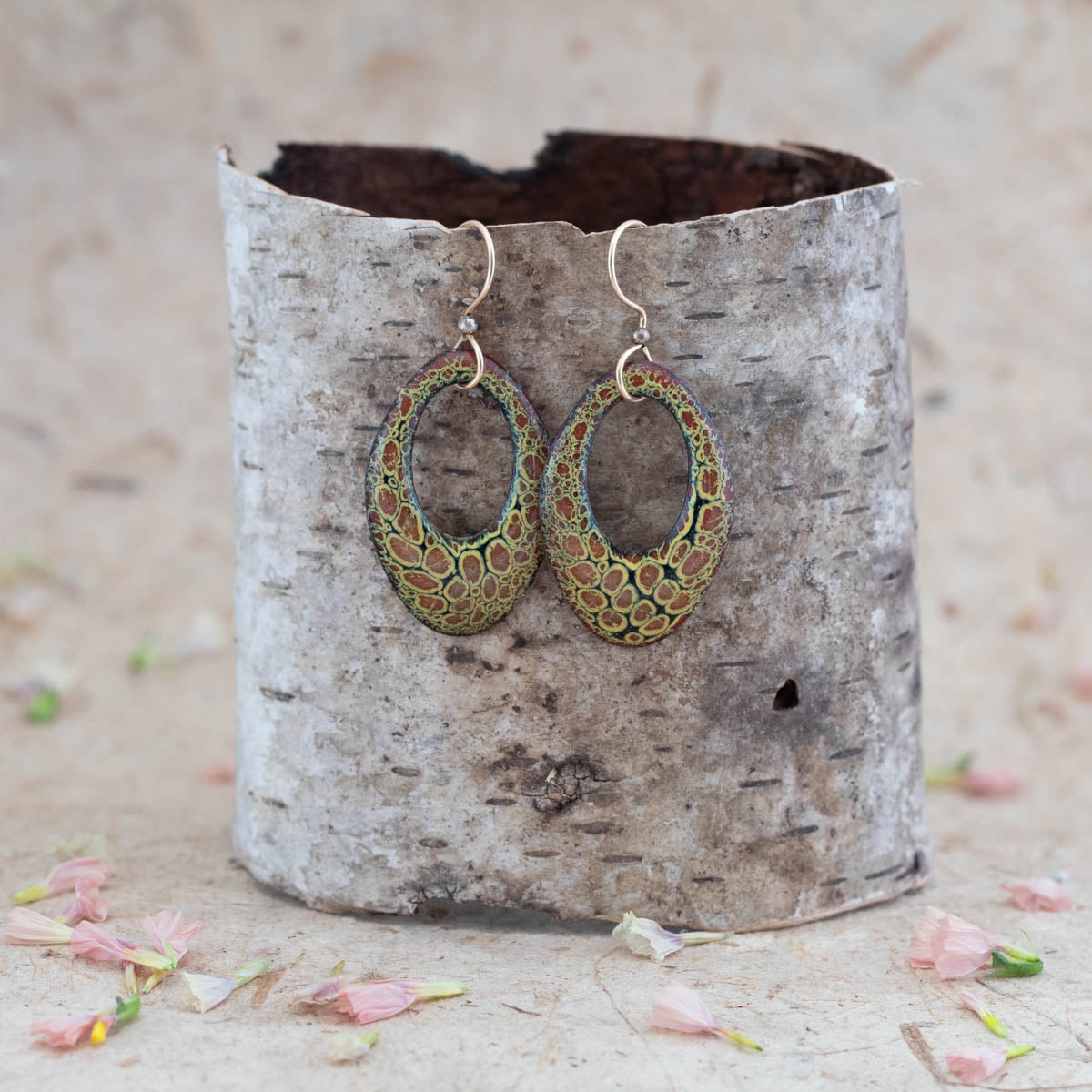 Handcrafted enamel oval dangle earrings with green and copper cell-like pattern, featuring earthy nature-inspired texture on copper and boho artisan style. 14k gold-filled earwires.