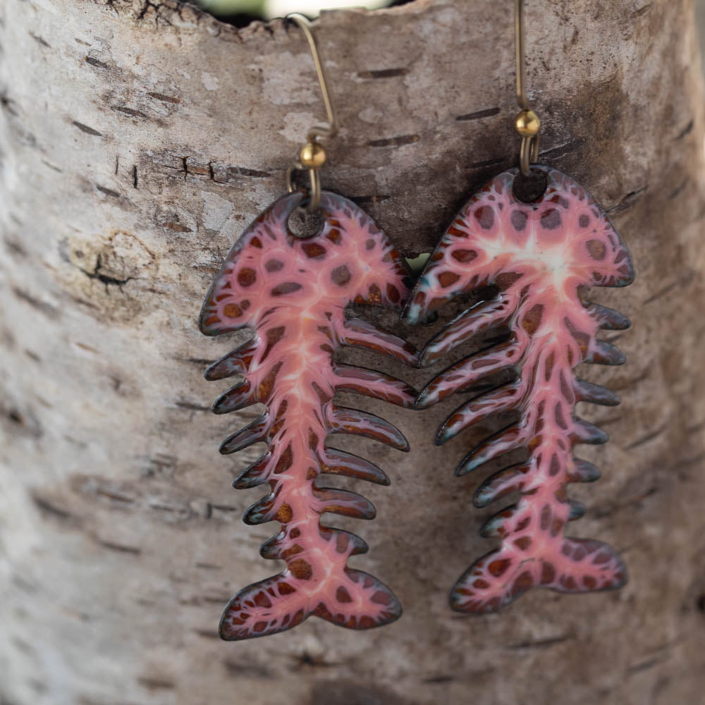 Colorful kiln-fired enamel fishbone earrings on copper with niobium ear wires, handmade by Divella Designs in Vermont.