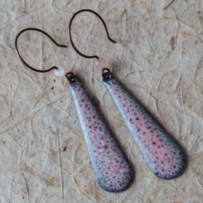 Pink enamel teardrop earrings with dark speckled detail, rose quartz beads, and niobium ear wires.