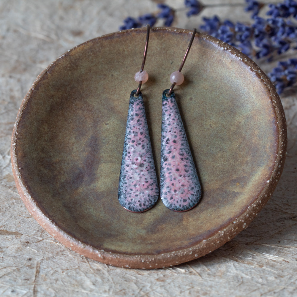 Pink enamel teardrop earrings with dark speckled detail, rose quartz beads, and niobium ear wires.