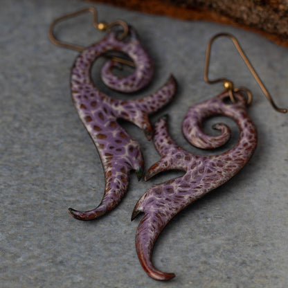 Handmade seaform curl earrings in kiln-fired enamel on copper with niobium ear wires. Lightweight, sculptural, and nature-inspired.