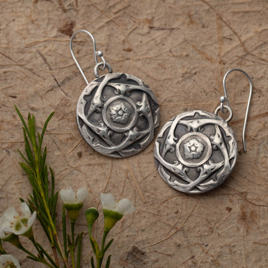 Artisan handmade sterling silver dangle earrings with intricate mandala-inspired floral pattern, featuring oxidized finish and vintage French button design elements.