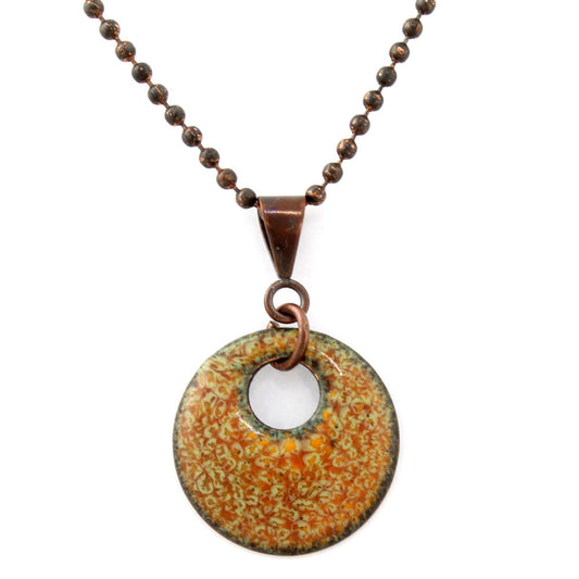 Round copper and enamel pendant on beaded chain with earthy orange and green pattern