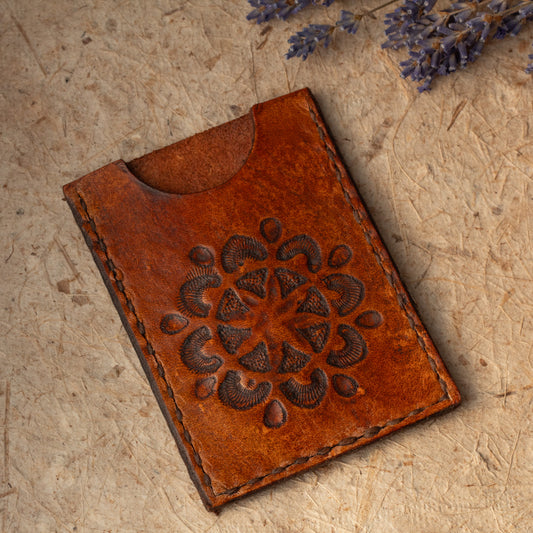 Handmade leather card case with rustic mandala design. Offered as a second due to stamping irregularities. Handmade in Vermont.