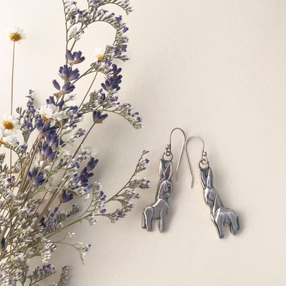Handmade fine and sterling silver donkey dangle earrings with detailed sculpted design, featuring playful animal-inspired jewelry with artisan charm.