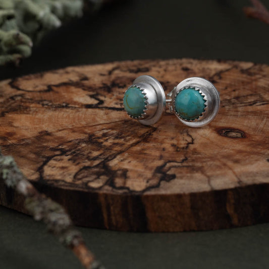 Handmade turquoise stud earrings in sterling silver with wide rim