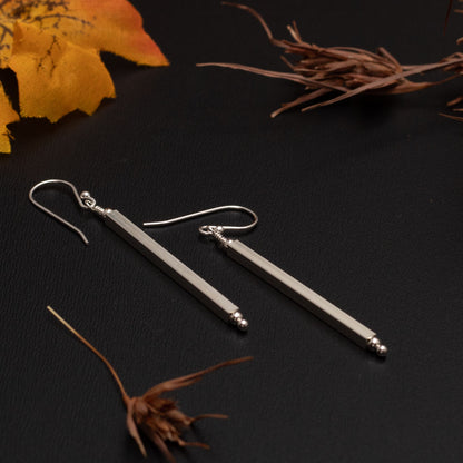 Long sterling silver drop earrings with minimalist bar design