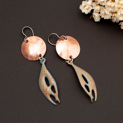 Handmade copper and enamel earrings with organic shape and hammered disc in orange and sky blue