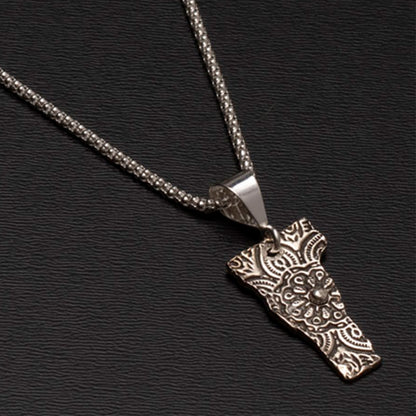 Textured fine silver Vermont necklace on a black textured background