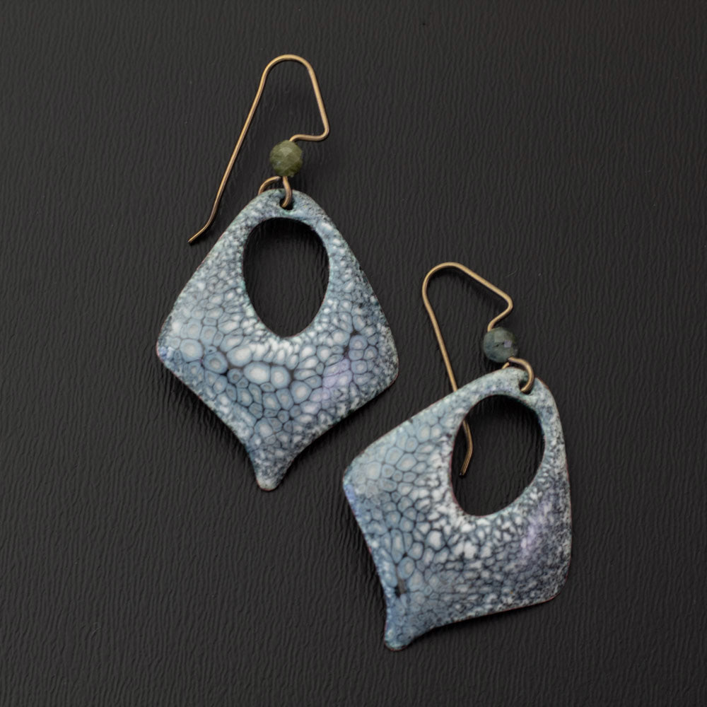 Close-up of smoky gray-blue kiln-fired enamel earrings with soft green genuine tourmaline accents and open diamond drop shapes.