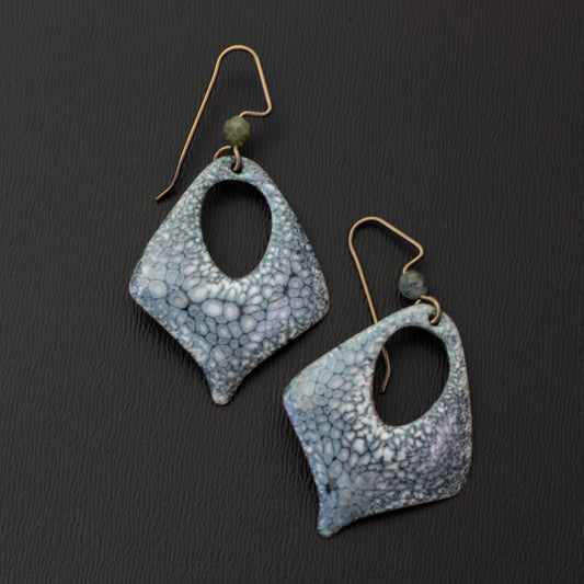 Close-up of smoky gray-blue kiln-fired enamel earrings with soft green genuine tourmaline accents and open diamond drop shapes.