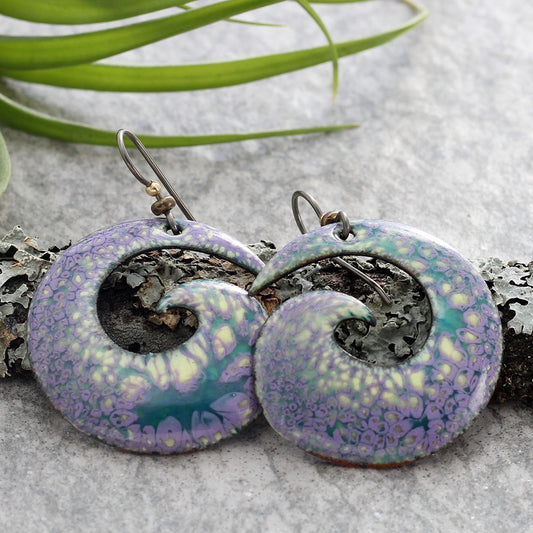 Handcrafted purple and yellow spiral enamel earrings with organic floral texture, artistic nature-inspired jewelry by Divella Designs."