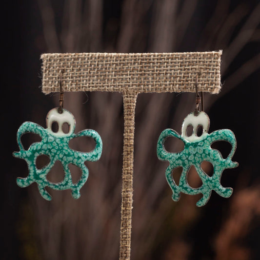Whimsical aqua enamel octopus earrings with niobium ear wires, handmade by Divella Designs.