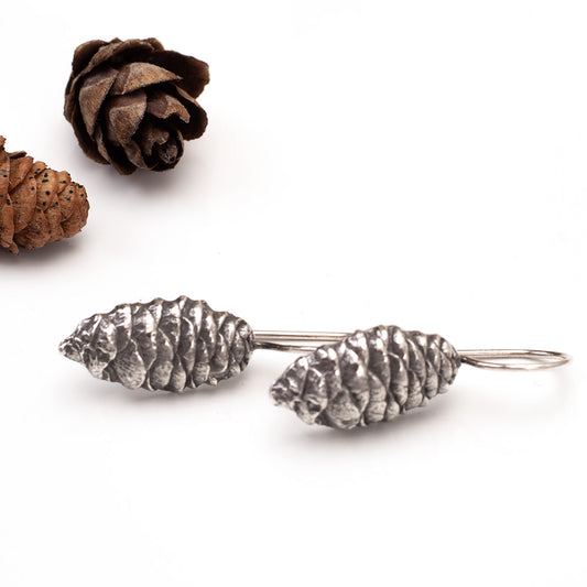 Sterling silver pine cone dangle earrings with nature-inspired design, handmade woodland jewelry