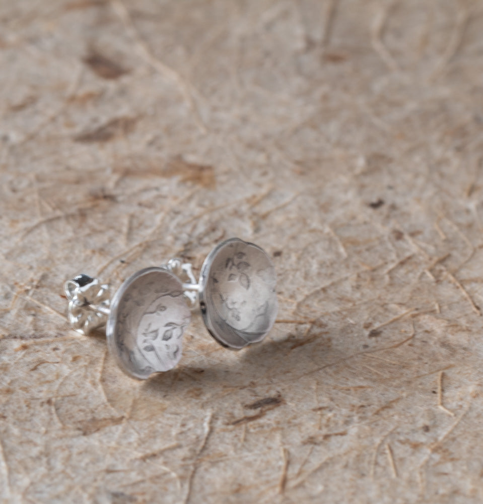 Silver earrings with a soft botanical texture handmade by Divella Designs