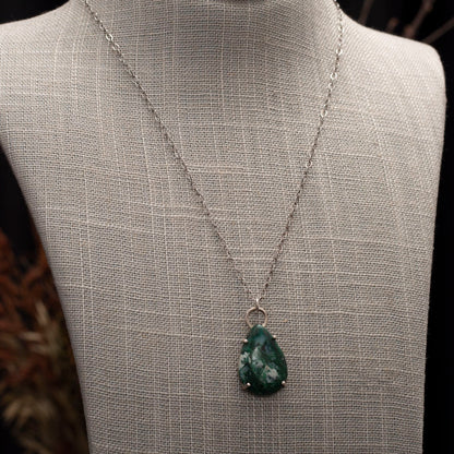 Teardrop-shaped green gemstone pendant with white inclusions on a sterling silver chain, handcrafted by Divella Designs.