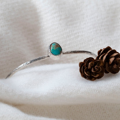 Turquoise from the King's Manassa mine and silver form a petite cuff great for stacking.