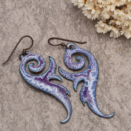 Purple and white enamel swirl dangle earrings with organic shapes and oxidized copper ear wires.