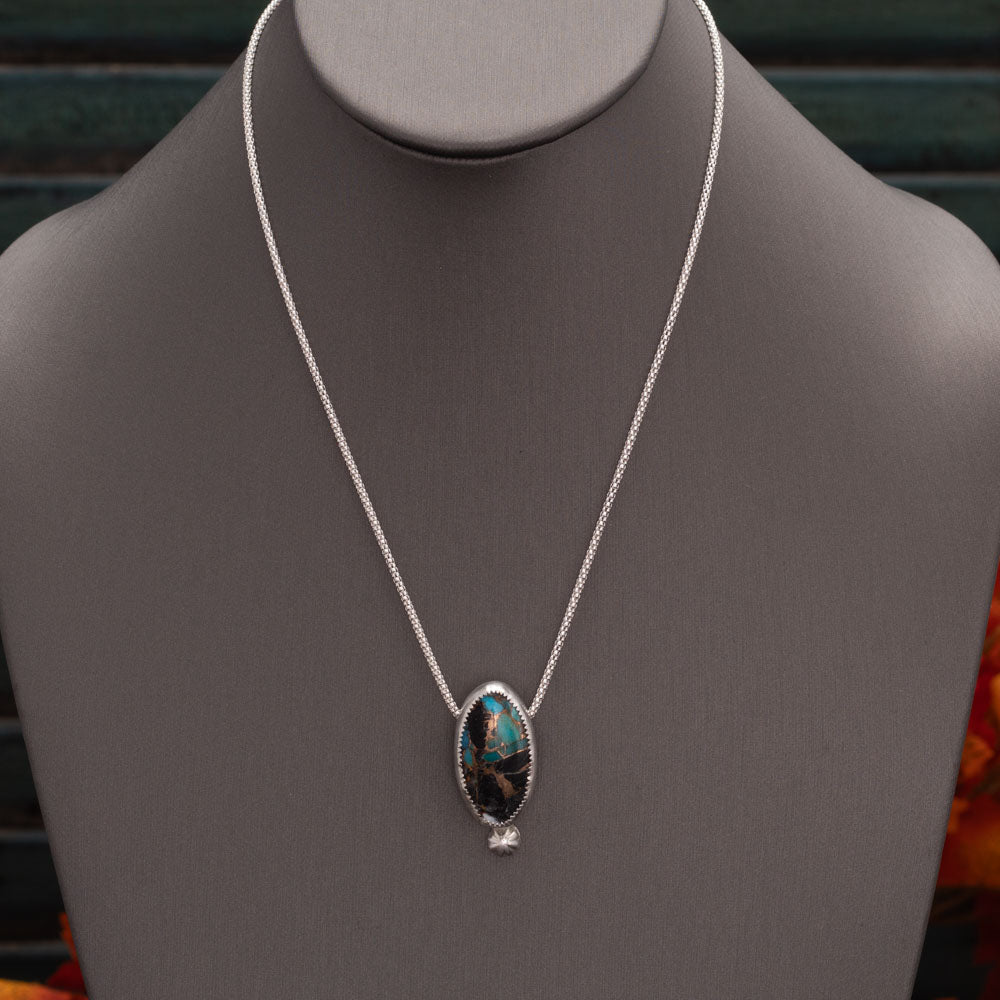 White Buffalo Kingman turquoise composite necklace with blue turquoise, white stone, bronze matrix, sterling silver setting, and 18 inch chain by Divella Designs.