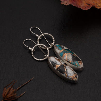 White Buffalo Kingman turquoise composite earrings with bronze matrix, fine silver settings, textured sterling silver hoops, and sterling silver ear wires, handmade by Divella Designs.