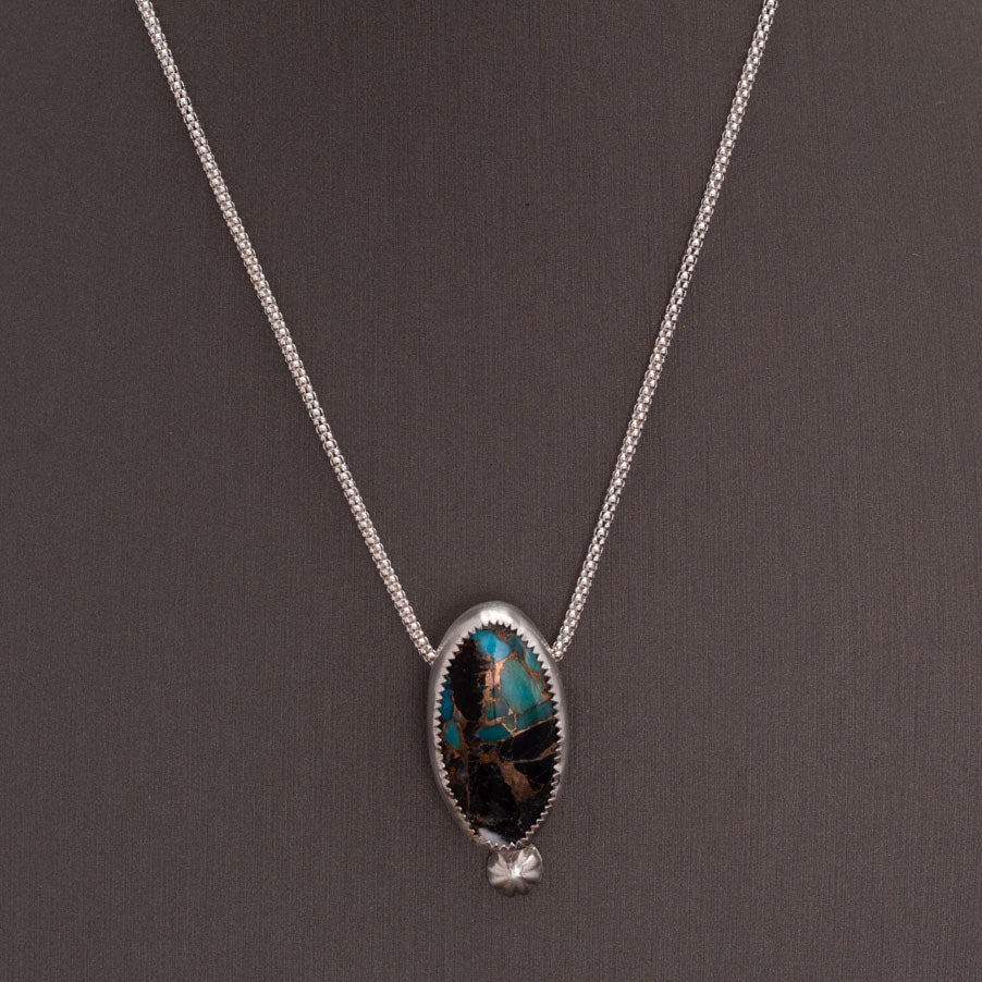 White Buffalo Kingman turquoise composite necklace with blue turquoise, white stone, bronze matrix, sterling silver setting, and 18 inch chain by Divella Designs.