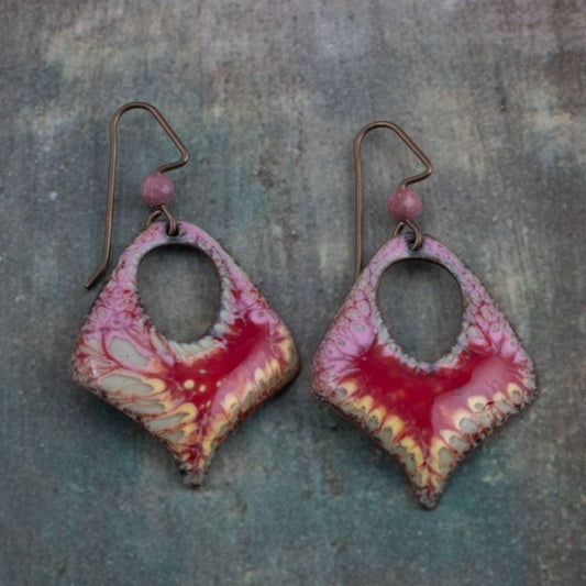 Handmade enamel earrings in pink and crimson with organic lace-like pattern, crafted on copper with niobium ear wires.