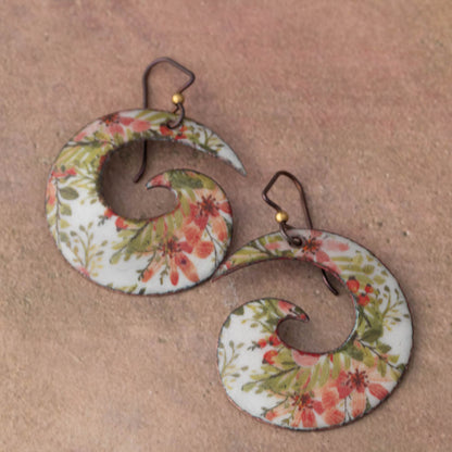 Pair of floral earrings on a beige background