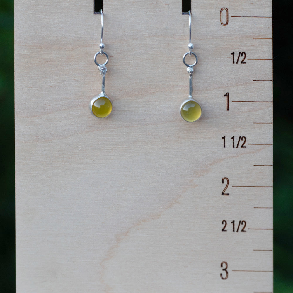 Yellow chalcedony drop earrings shown beside an inch ruler to demonstrate their length and scale