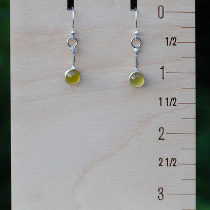 Yellow chalcedony drop earrings shown beside an inch ruler to demonstrate their length and scale