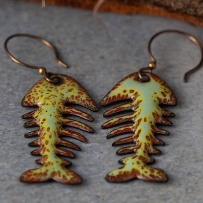 Colorful kiln-fired enamel fishbone earrings on copper with niobium ear wires, handmade by Divella Designs in Vermont.