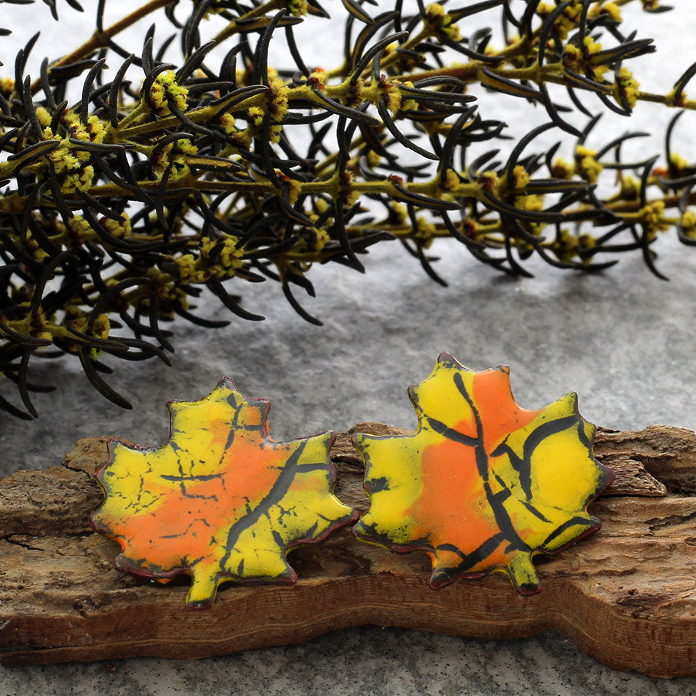 Enamel maple leaf stud earrings in assorted fall colors