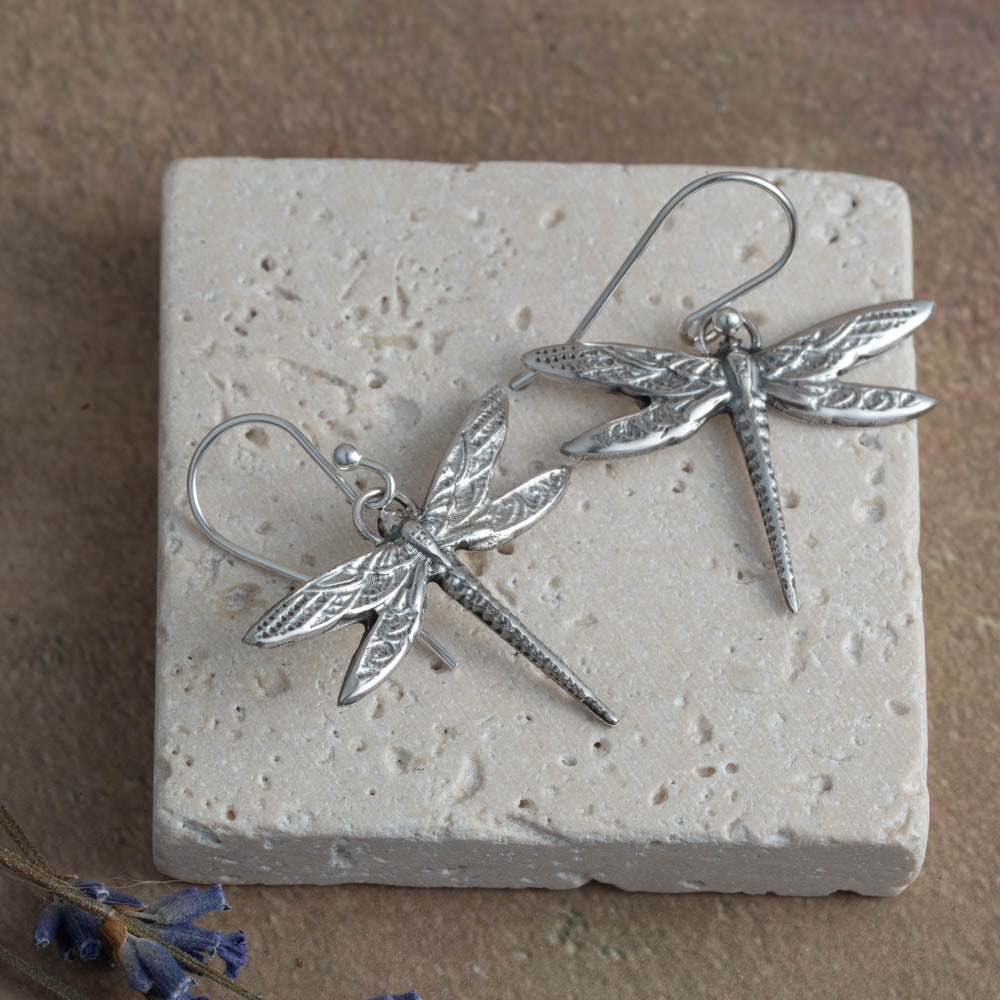 Handmade sterling silver dragonfly earrings with detailed wings. Lightweight, nature-inspired jewelry crafted in Vermont.