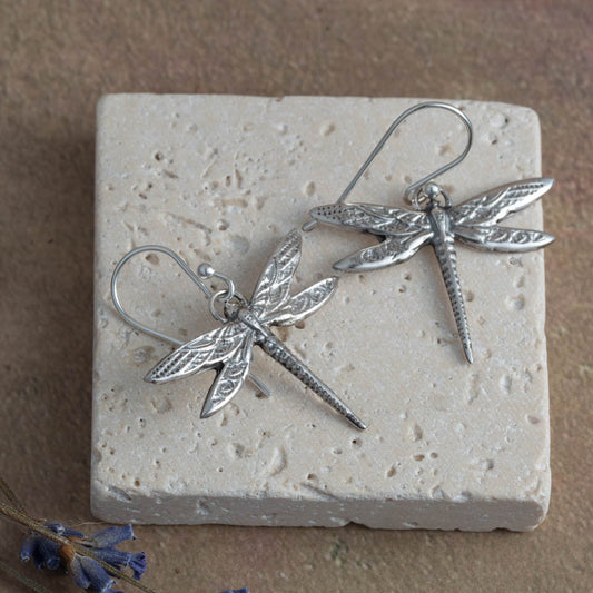 Handmade sterling silver dragonfly earrings with detailed wings. Lightweight, nature-inspired jewelry crafted in Vermont.