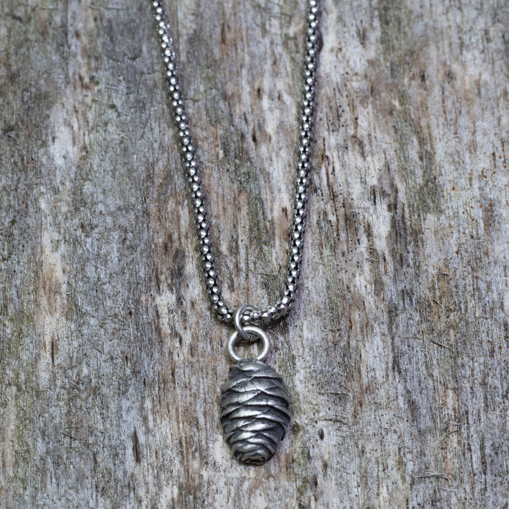 Solid sterling silver pine cone pendant on oxidized bead chain.