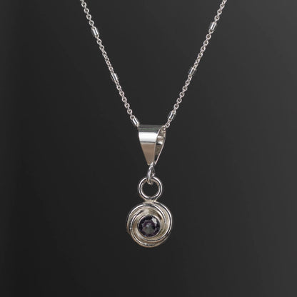 Sterling silver pendant necklace with simulated alexandrite that shifts from greenish-blue to deep violet, handmade in Vermont by Divella Designs.