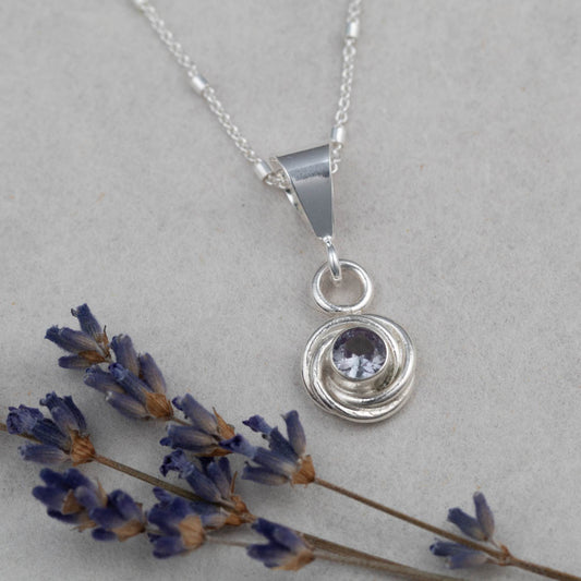 Sterling silver pendant necklace with simulated alexandrite that shifts from greenish-blue to deep violet, handmade in Vermont by Divella Designs.