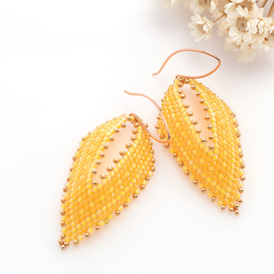 yellow beaded leaf earrings