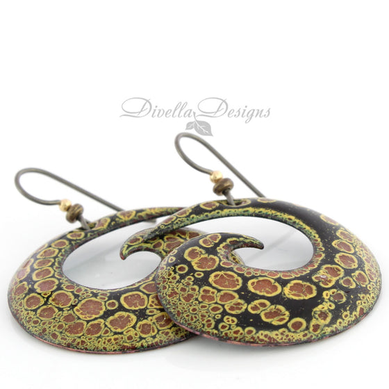 Black, copper and yellow spiral shaped boho earrings by Divella Designs. The ear wires are niobium.