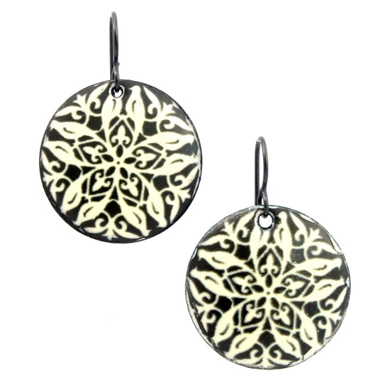 Black and cream kiln-fired enamel earrings on copper with lacework-inspired pattern and hypoallergenic niobium ear wires.