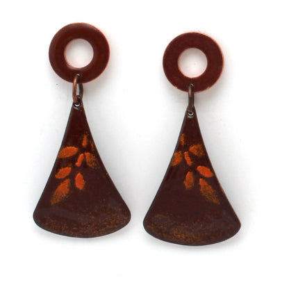 Rusty red enamel dangle earrings with circular copper studs and flared triangular drops, featuring a subtle golden leaf pattern.