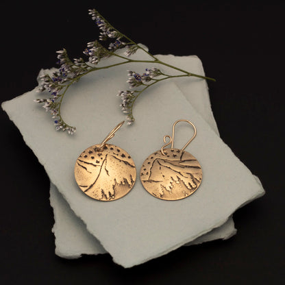 Brass mountain and stars earrings with impressed night-sky landscape, 14k gold-filled ear wires, and 1 3/8 inch length, handmade by Divella Designs in Vermont.