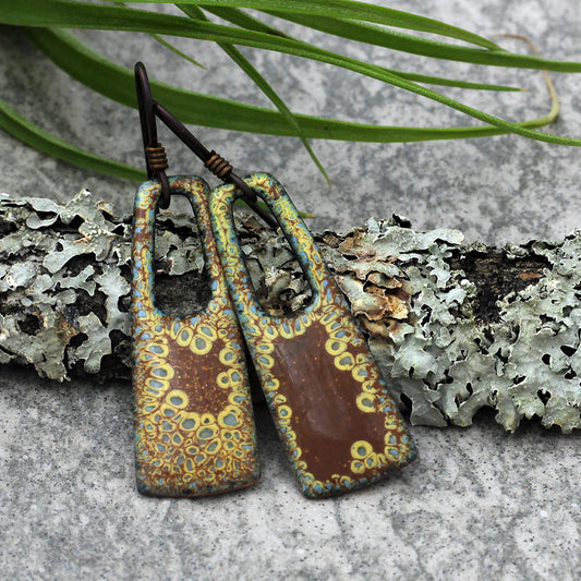 Earth-toned enamel earrings with open arch design and niobium ear wires
